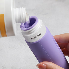 CHEODIN travel bottles showing wide opening for easy filling