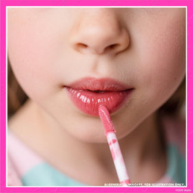 Child applying Townley Girl Barbie lip gloss at a slumber party