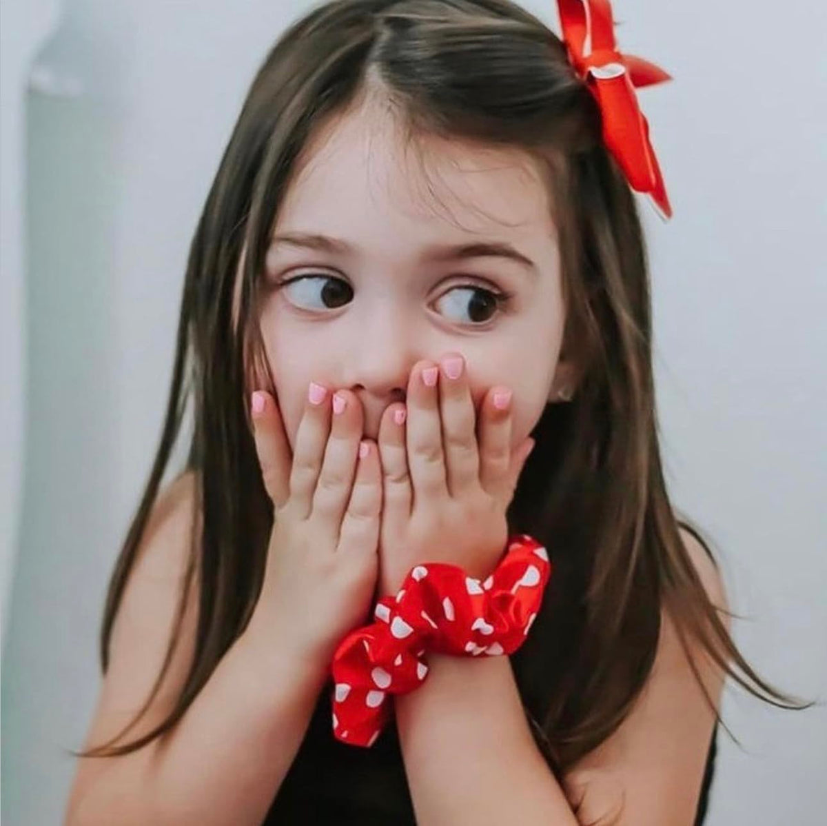 Child enjoying nail painting with Piggy Paint products