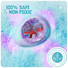 Child excitedly revealing a dinosaur from a bath bomb