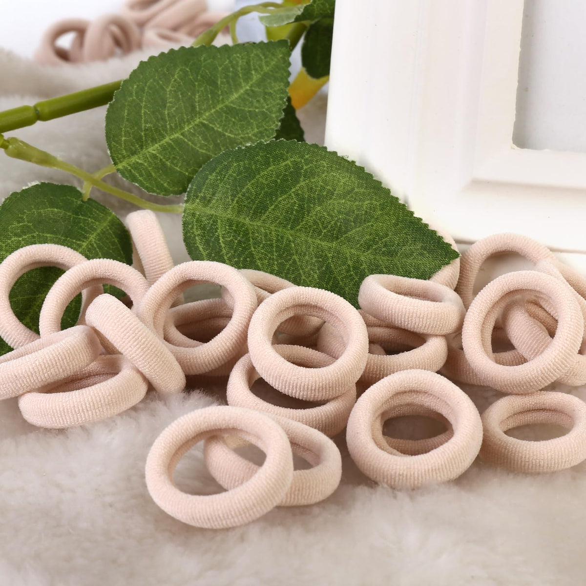 Child's hair styled with Qarwayoc blonde hair ties