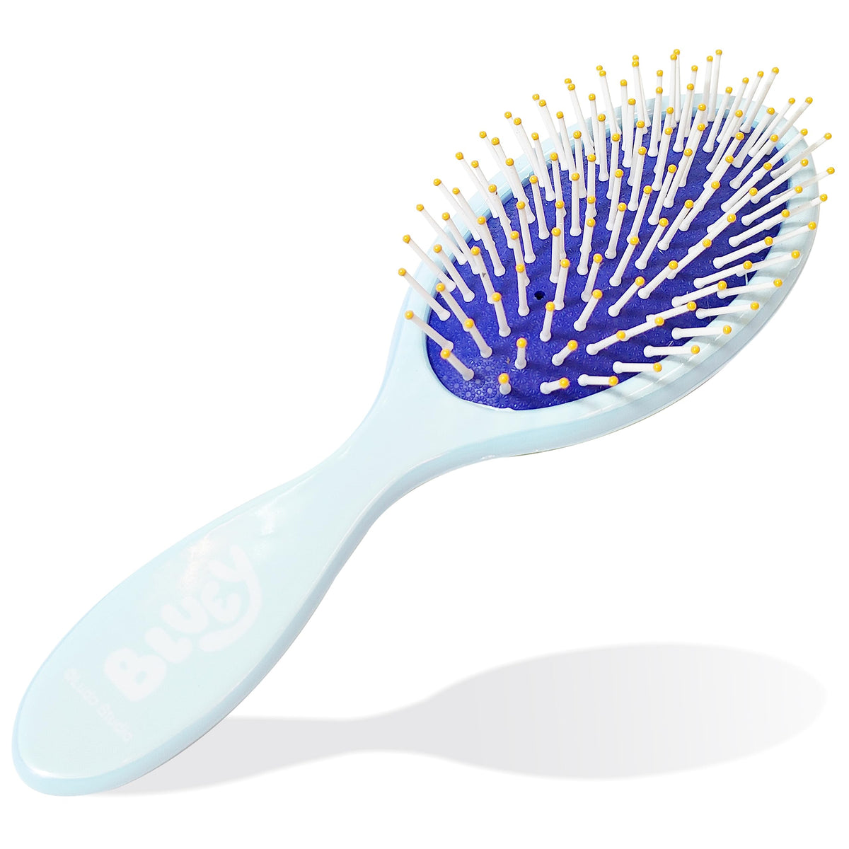 Child using Bluey hairbrush in a playful setting