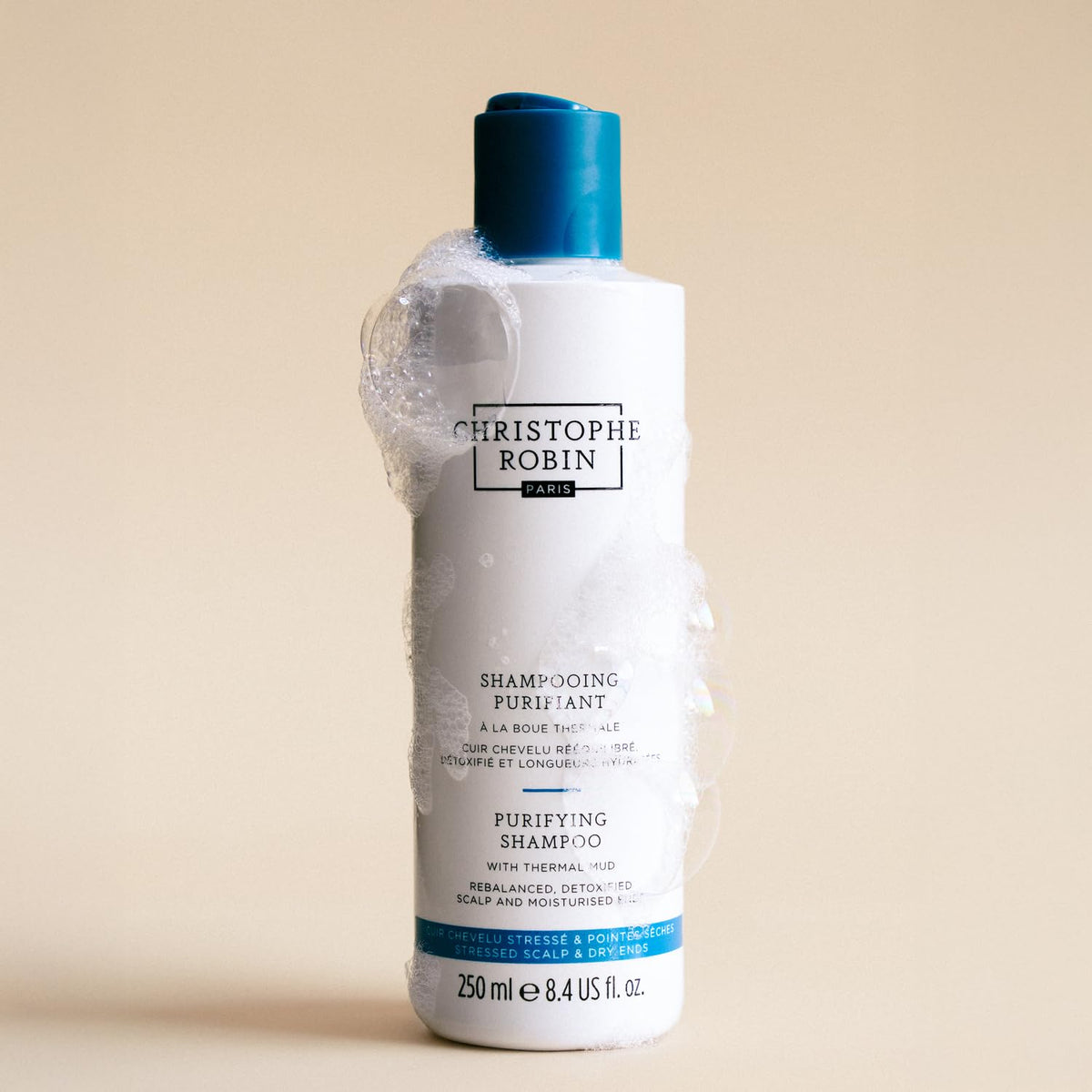 Christophe Robin Purifying Shampoo with ingredients displayed