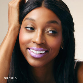 City Beauty City Lips Plumping Lip Gloss Orchid in natural light