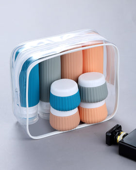 Clear makeup bag containing travel containers