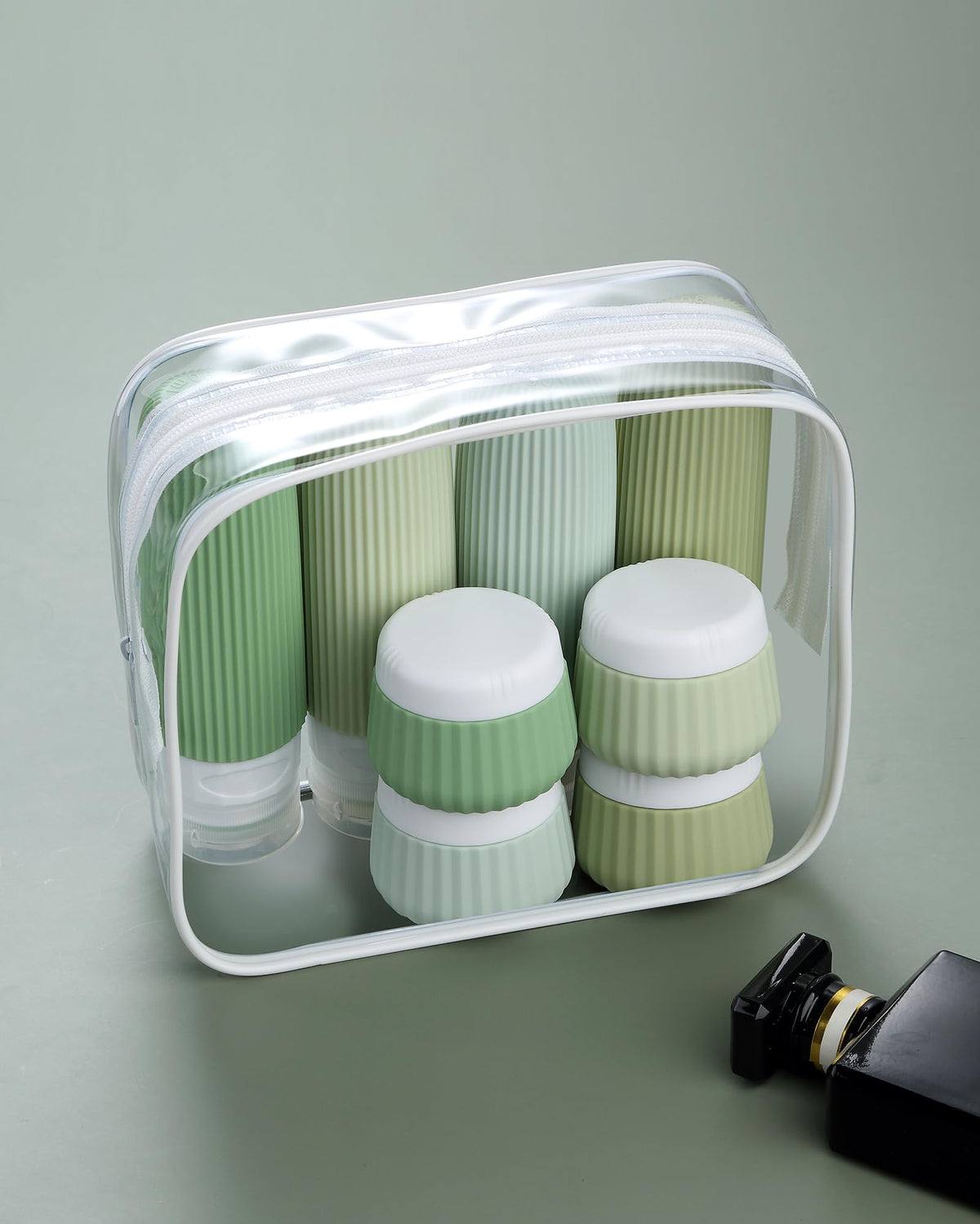 Clear makeup bag holding Mrsdry travel bottles