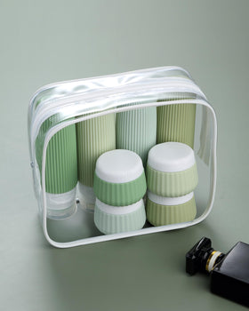 Clear makeup bag holding Mrsdry travel bottles