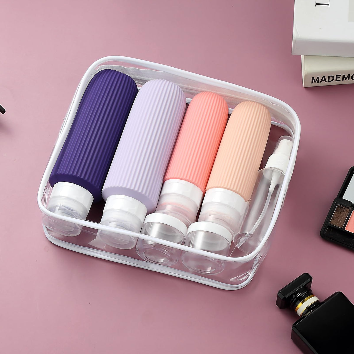 Clear toiletry bag holding Mrsdry travel containers