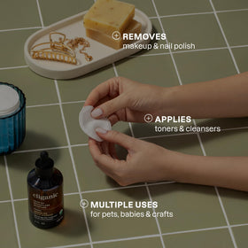 Cliganic cotton rounds being used for makeup removal