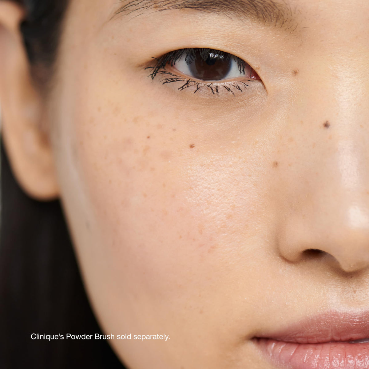 Clinique Blended Face Loose Setting Powder on a makeup vanity