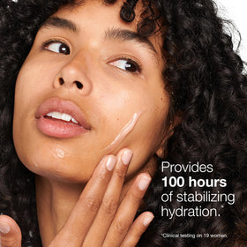 Clinique Moisture Surge 100H on a bathroom counter