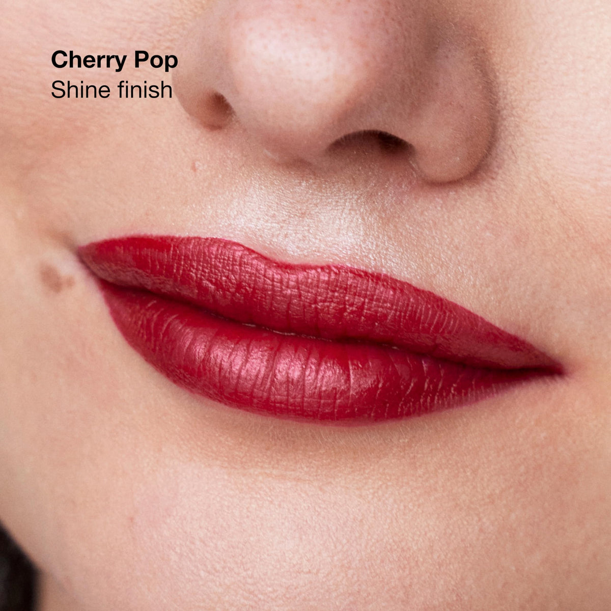 Clinique Pop Longwear Lipstick Cherry Pop swatch on skin