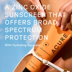 Close-up of Acure Mineral Sunscreen SPF 50 tube and cap
