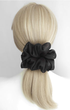 Close-up of AnnushkaHomeDecor scrunchie showing soft chiffon texture