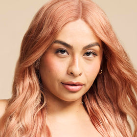 Close-up of ARCTIC FOX Apricot Anarchy hair dye texture in a bowl