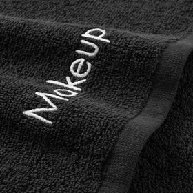 Close-up of Arkwright makeup remover towel with embroidery