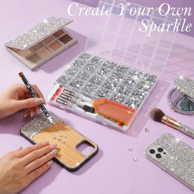 Close-up of assorted sizes of silver rhinestones in the kit