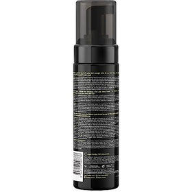 Close-up of B.TAN Dark Self Tanner foam bottle