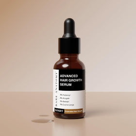 Close-up of Bare Anatomy Advanced Hair Growth Serum bottle showing ingredients
