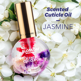 Close-up of Blossom Cuticle Oil bottle with dried flowers