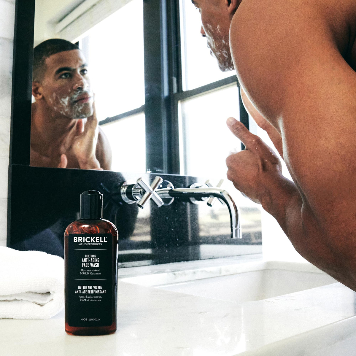 Close-up of Brickell Men's Anti-Aging Face Wash bottle