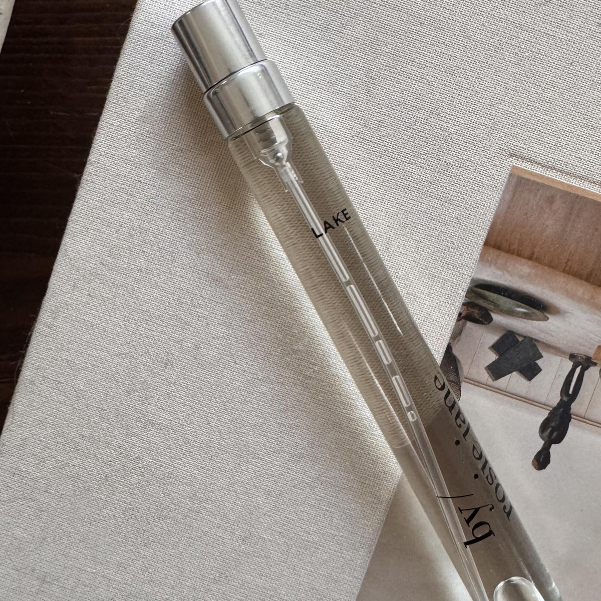 Close-up of By Rosie Jane Travel Perfume Spray (Lake) bottle