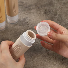 Close-up of CHEODIN travel bottle cap with flow-control hole