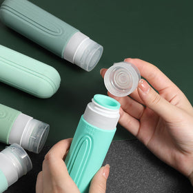 Close-up of CHEODIN travel bottle with cross-shaped flow-control hole