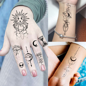 Close-up of COKTAK temporary tattoos featuring stars and planets