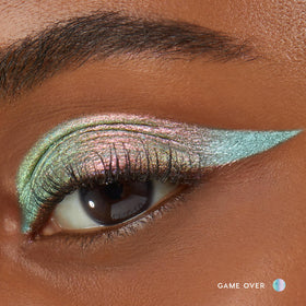 Close-up of ColourPop cream eyeshadow stick Galaxy in magenta with olive and gold