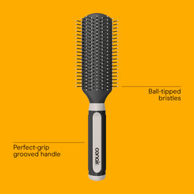 Close-up of Conair hairbrush with ball-tipped nylon bristles