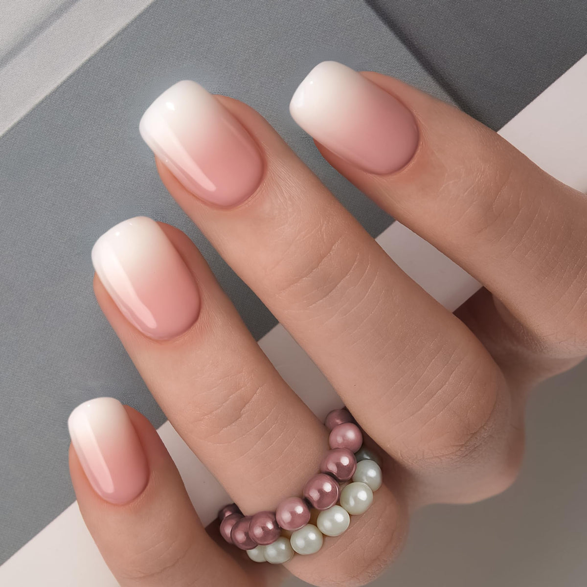 Close-up of CurvLife handmade gel French tip nails