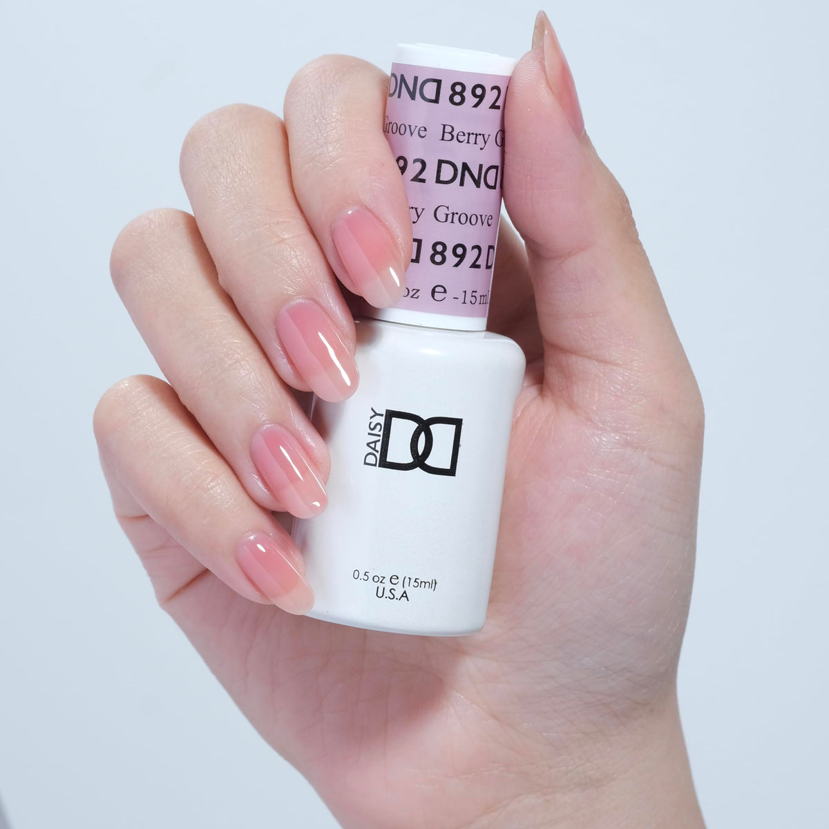 Close-up of DAISY DND Berry Groove #892 gel polish bottle