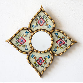 Close-up of DecorContreras mirror with bronze leaf accents