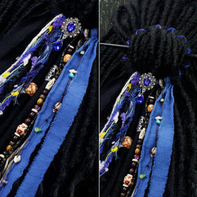 Close-up of dreadlock hair tie showing metal accessories and fabric