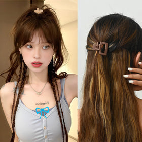 Close-up of Drnytunk hair clips showing intricate designs and colours