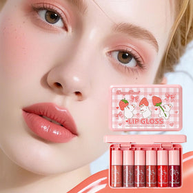 Close-up of Eakroo lip gloss in nude pink shade