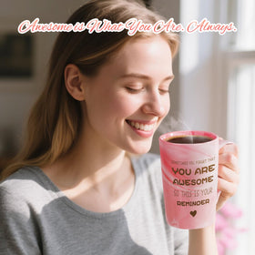 Close-up of Eletorot pink marble mug with spoon