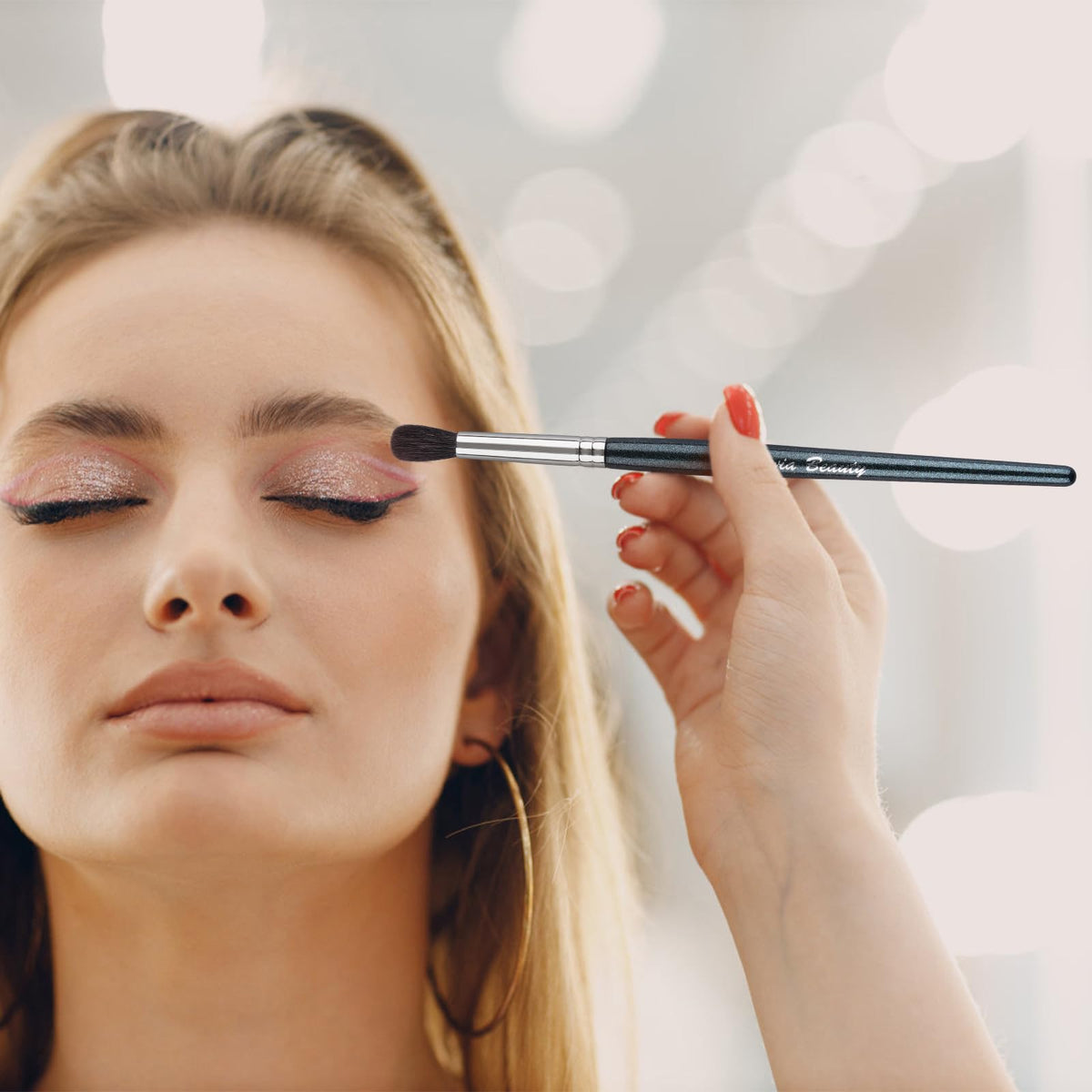 Close-up of EVRCHGIEA eye makeup brush with wooden handle