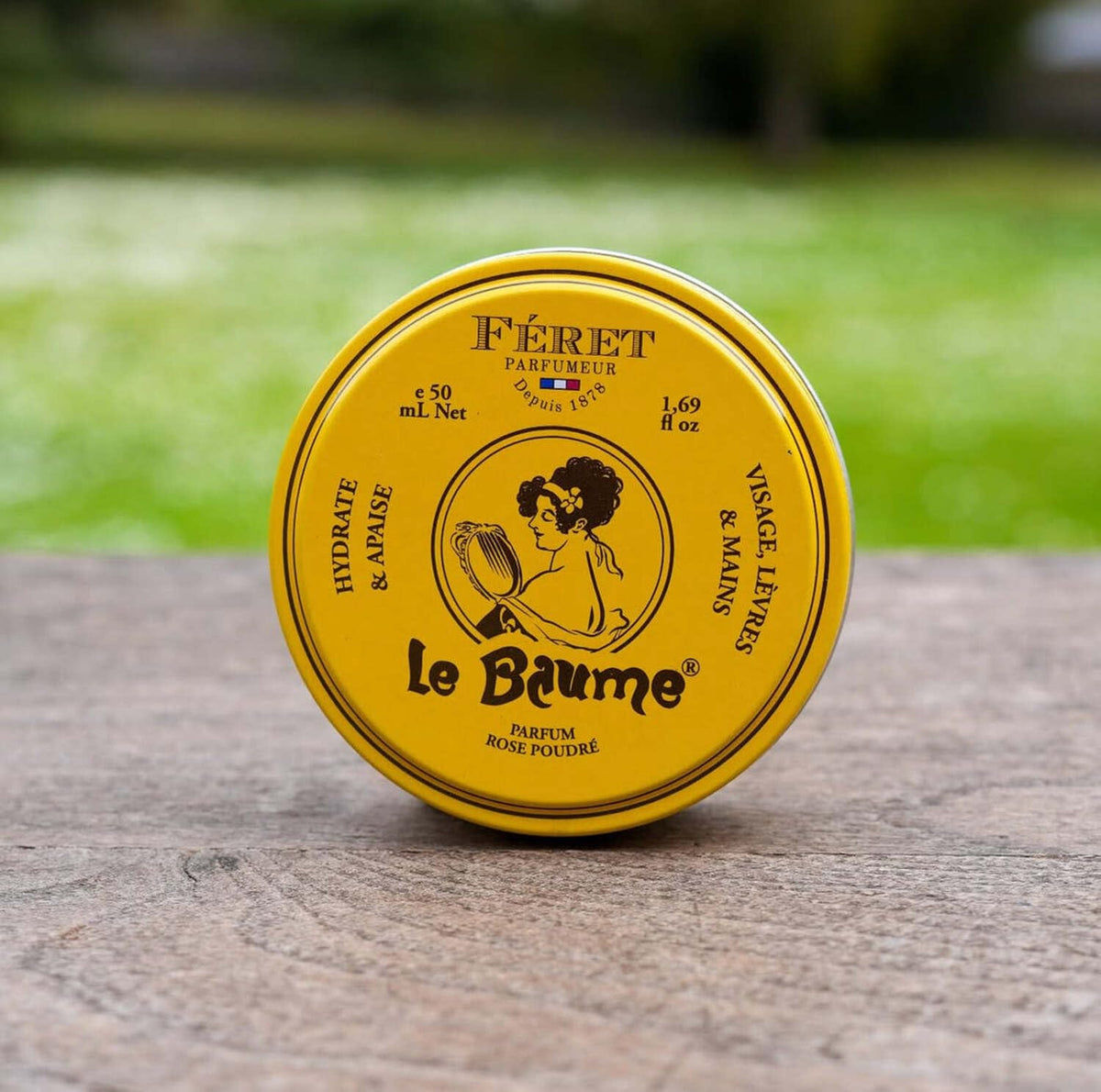 Close-up of Feret Parfumeur balm texture on a fingertip