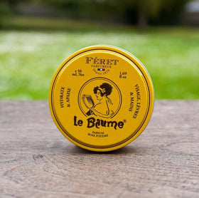 Close-up of Feret Parfumeur balm texture on a fingertip