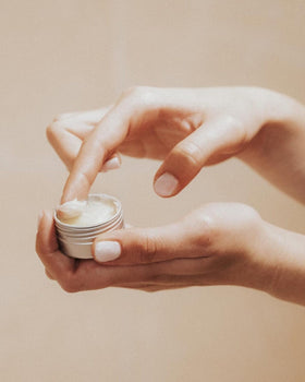 Close-up of Feret Parfumeur balm with shea butter and honey ingredients