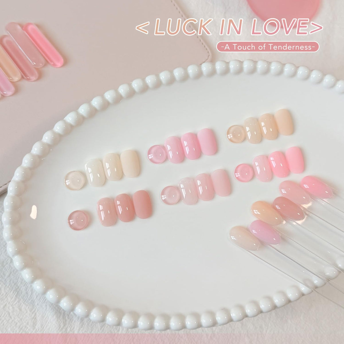 Close-up of GAOY Jelly Gel Nail Polish bottles in pink, white, and nude