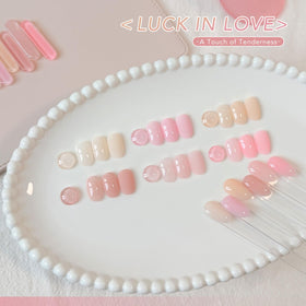 Close-up of GAOY Jelly Gel Nail Polish bottles in pink, white, and nude