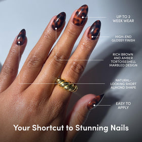 Close-up of Glamnetic Short Almond Press On Nails showing marbled finish