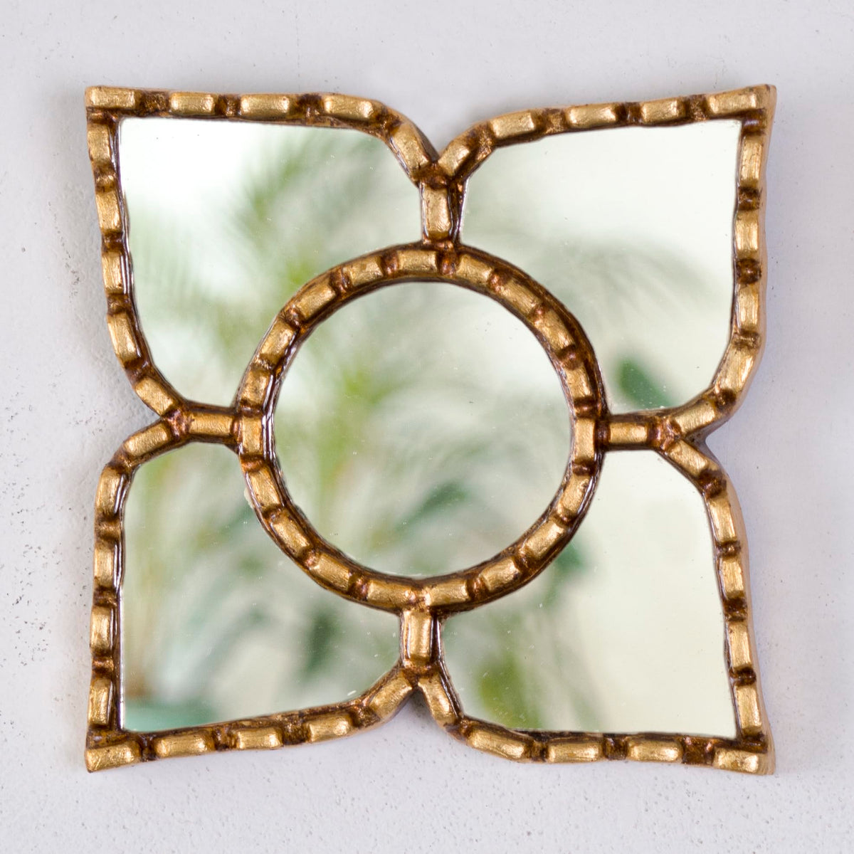 Close-up of gold leaf gilding on DecorContreras mirror
