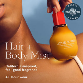 Close-up of Josie Maran Vanilla Vibezzz fragrance mist bottle