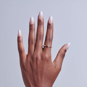 Close-up of KISS Core Press On Nails 'Dulcet' pink with various sizes