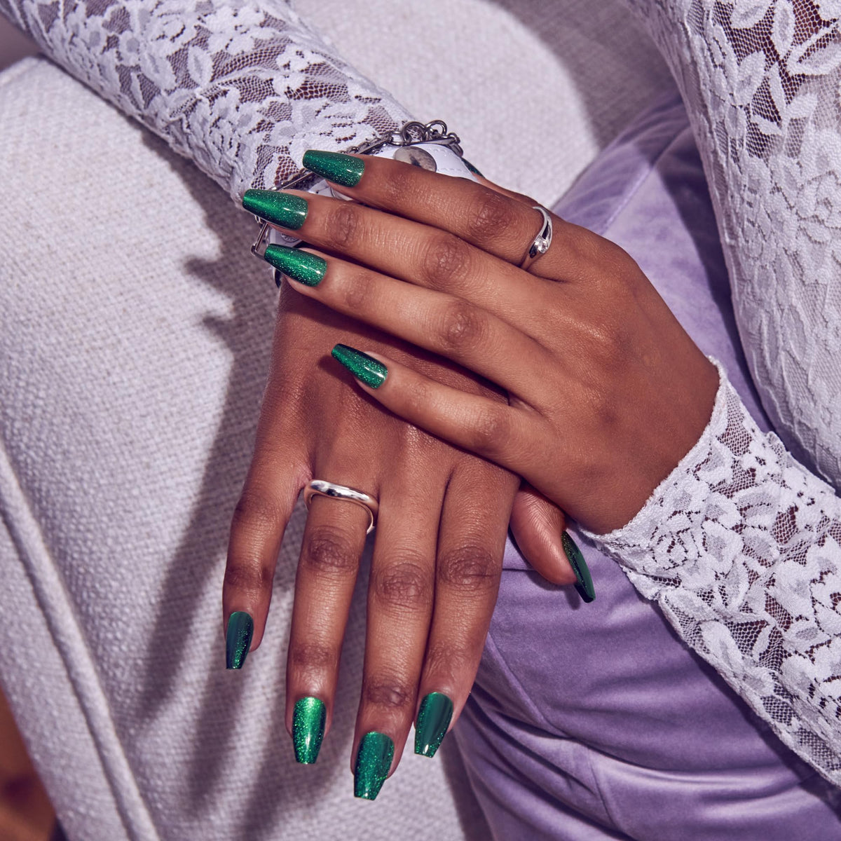 Close-up of KISS Press On Nails 'Shimmering' Green nail design