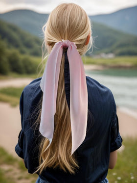 Close-up of LFOUVRE knotted bow hair scrunchie with ribbon